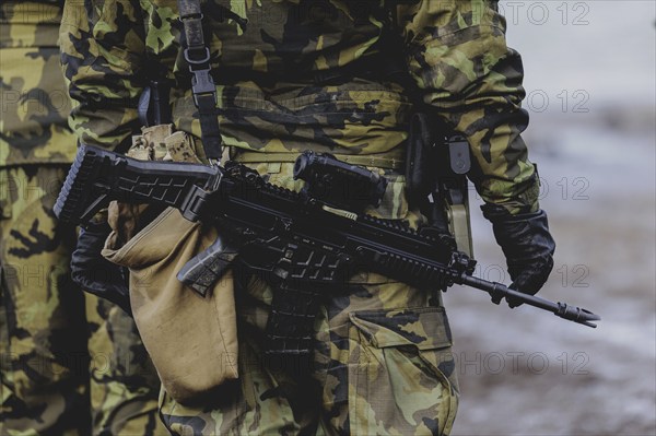 A soldier with a rifle, taken during the military exercise 'Wettiner Schwert' with German and Czech soldiers near Tangermünde, 26 March 2024. 'Wettiner Schwert' is part of the NATO Quadriga exercise