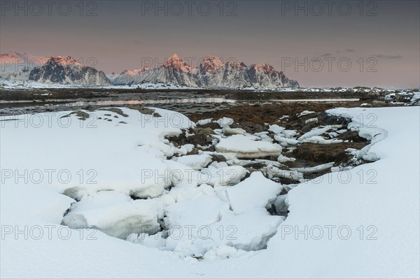 Winter landscape, mountain peaks in the sunset, Lofoten island Vestvågøya at the fjord Gimsøystraumen, Lofoten, Northern Norway, Norway, Europe