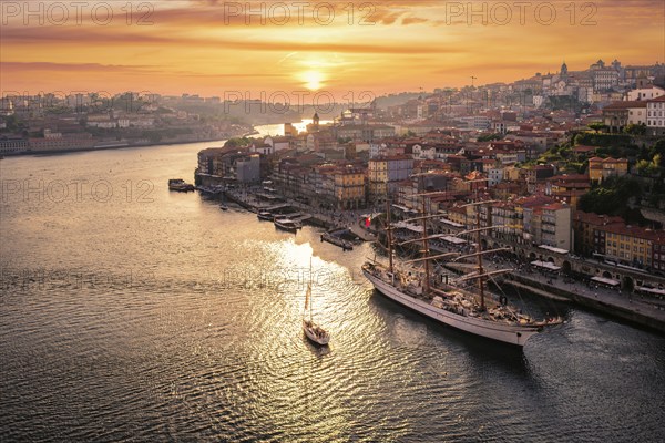 View of Porto city and Douro river from famous tourist viewpoint Miradouro do Jardim do Morro on sunset. Porto, Vila Nova de Gaia, Portugal, Europe