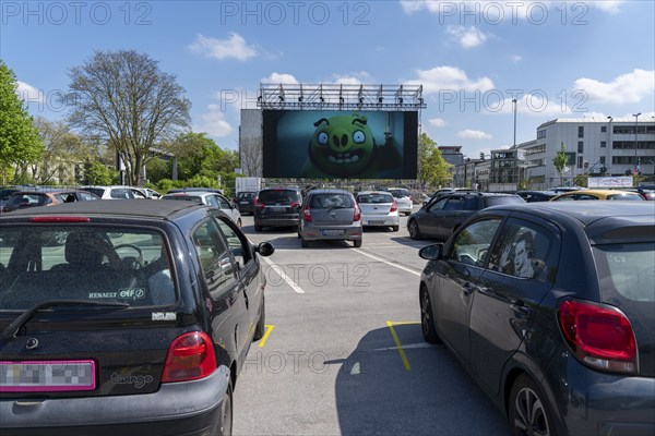 Temporary drive-in cinema, in the car park in front of Messe Essen, Grugahalle, large LED screen also allows film screenings in the sunshine, family film, effects of the corona crisis in Germany