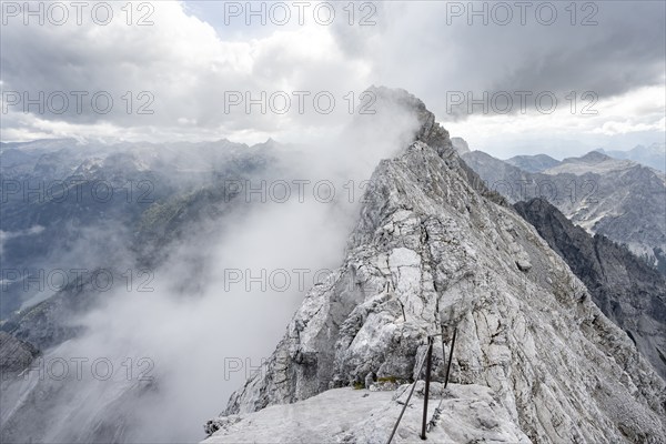 Clouds around a narrow rocky ridge, Watzmann crossing to Watzmann Mittelspitze, view of mountain panorama, Berchtesgaden National Park, Berchtesgaden Alps, Bavaria, Germany, Europe