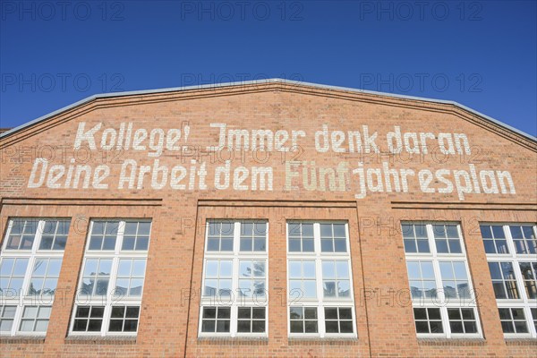 Inscription, colleague! Always remember your work to the five-year plan, Stage 19, Filmhalle, Studio Babelsberg, former factory premises of Orenstein & paddock, Ahornstraße, Babelsberg, Potsdam, Brandenburg, Germany, Europe