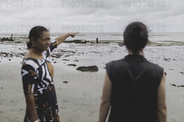 (L-R) Christine Fung, employee of the Deutsche Gesellschaft für Internationale Zusammenarbeit, and Annalena Bärbock (Bündnis 90/Die Grünen), Federal Foreign Minister, photographed during a briefing on coastal erosion at a cemetery near the settlement of Togoru flooded by rising sea levels, 07.05.2024. Bärbock is travelling to Australia, New Zealand and Fiji for political talks / Photographed on behalf of the Federal Foreign Office