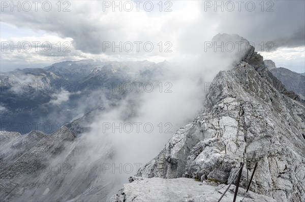 Clouds around a narrow rocky ridge, Watzmann crossing to Watzmann Mittelspitze, view of mountain panorama, Berchtesgaden National Park, Berchtesgaden Alps, Bavaria, Germany, Europe