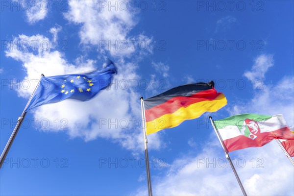 Waving flag of the European Union, Germany flag, state flag of North Rhine-Westphalia