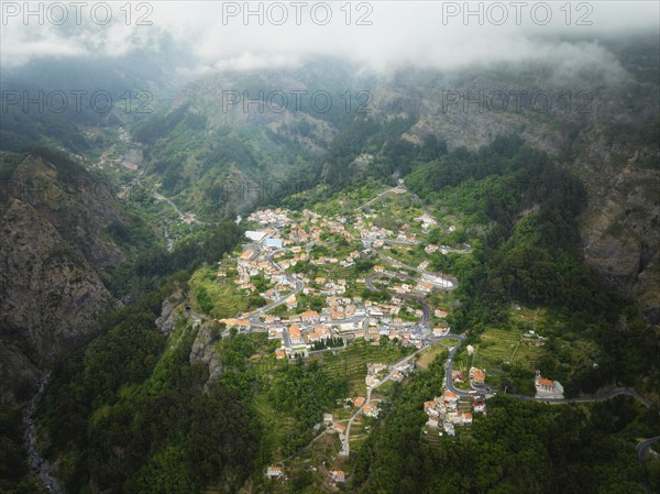 Aerial drone view of Curral das Freiras village in Valley of the Nuns from Miradouro da Eira do Serrado, Madeira island, Portugal, Europe