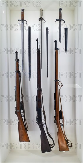 Belgian Mauser Model 1889, standard and short version carbine and Lebel Fusil Modèle 1886/M93, French rifle with bayonets on display