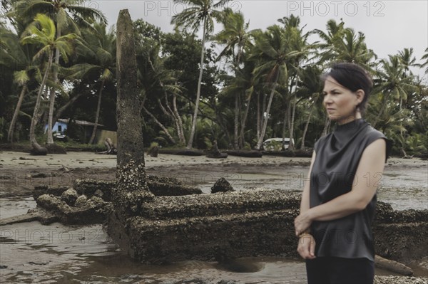 Annalena Bärbock (Bündnis 90/Die Grünen), Federal Foreign Minister, photographed during a briefing on coastal erosion at a cemetery near the settlement of Togoru, flooded by rising sea levels, 07.05.2024. Bärbock is travelling to Australia, New Zealand and Fiji for political talks / Photographed on behalf of the Federal Foreign Office