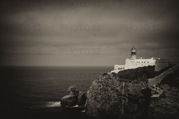 Lighthouse Farol do Cabo de São Vicente, Cape St. Vincent, Sagres, cliffs, Atlantic Ocean, black and white, vintage, Algarve, Portugal, Europe