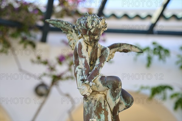 Close-up of an angel statue with weathered patina sitting on a pedestal, thermal springs, thermal baths, thermal baths of Kallithea, Kallithea, Rhodes, Dodecanese, Greek Islands, Greece, Europe