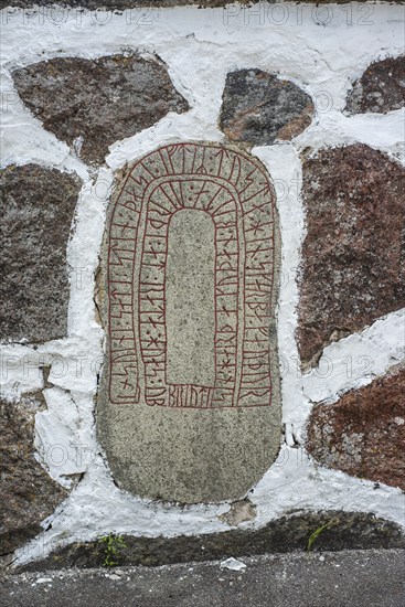 Rune stone embedded in a wall in Glemmingebro, Ystad Municipality, Skåne County, Sweden, Scandinavia, Europe