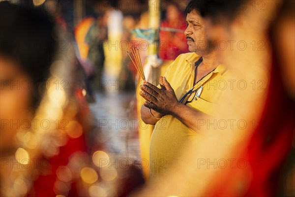 Hindu devotees perform rituals as they offer prayers to the Sun god in the bank of Brahmaputra river on the occasion of the 'Chhath Puja' festival in Guwahati, Assam, India on 7 November 2024. Chhath Puja is a significant Hindu festival celebrated primarily in the Indian states of Bihar, Jharkhand, Uttar Pradesh, and in Nepal. Dedicated to the worship of the Sun God (Surya) and his wife Usha (also referred to as Chhathi Maiya), this festival seeks blessings for prosperity, health, and longevity