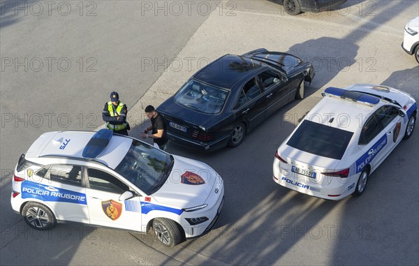 Looking down of Traffic police checking a vehicle, Mother Theresa Rinas Airport, Tirana, Albania, Europe