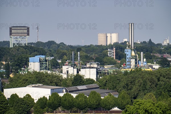 View from the Deusenberg slagheap to the east, hammerhead tower of the Minister Stein colliery, KG Deutsche Gasrußwerke GmbH & Co on the right, North Rhine-Westphalia, Germany, Europe