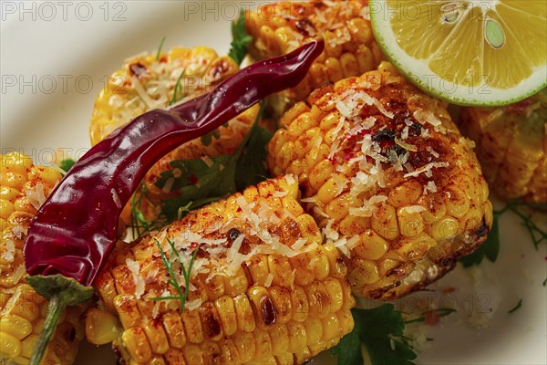 Grilled corn with spices, top view, no people, homemade