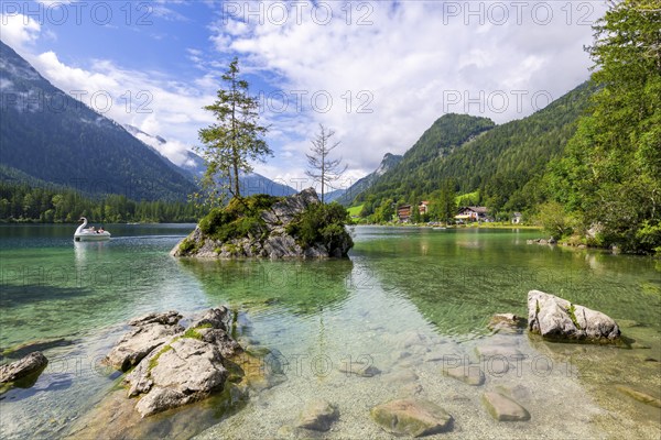 Hintersee near Ramsau with clear green water, surrounded by forests and mountains under a cloudy sky, pedal boat, swan, Berchtesgaden National Park, Berchtesgadener Land, Upper Bavaria, Bavaria, Germany, Europe