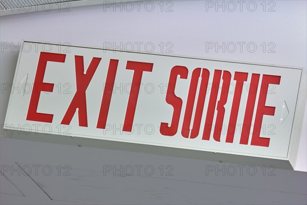 A sign with the inscription 'EXIT SORTIE' in red, Toronto Airport, Ontario, Canada, North America