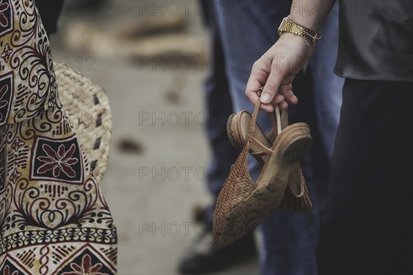 (R-L) Annalena Bärbock (Bündnis 90/Die Grünen), Federal Foreign Minister, and Lavenia McGoon, resident of the Togoru settlement, photographed during a briefing on coastal erosion at a cemetery near the Togoru settlement flooded by rising sea levels, 07.05.2024. Bärbock is travelling to Australia, New Zealand and Fiji for political talks / Photographed on behalf of the Federal Foreign Office