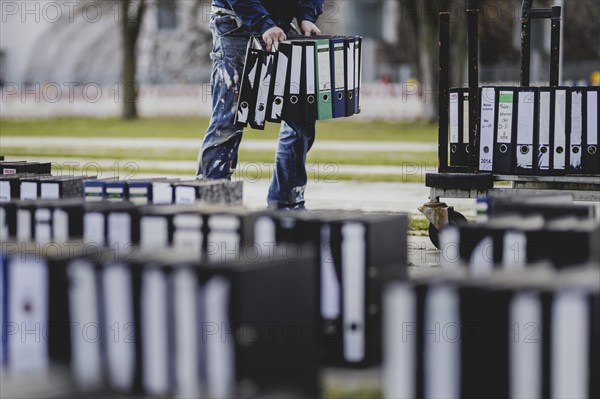 Files are cleared away after a protest action by the German Confederation of Skilled Crafts in front of the Federal Chancellery in Berlin, 26 February 2024. The German Confederation of Skilled Crafts demonstrates against the economic policy of the federal government as well as the high level of bureaucracy and the improvement of location conditions