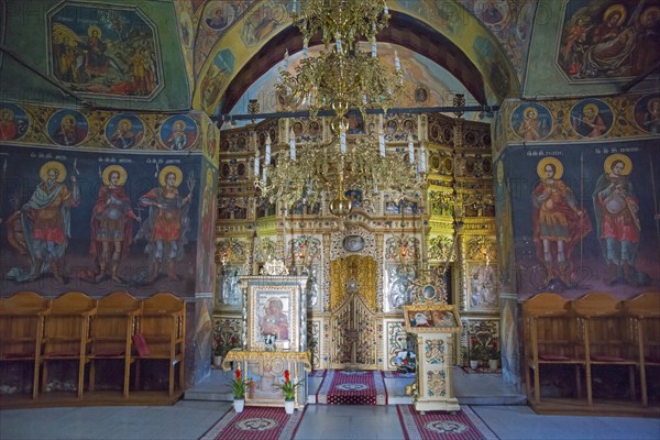 Interior view of an Orthodox church with richly decorated iconostasis and murals, Cheia Romanian Orthodox Monastery, Maneciu, Maneciu, Prahova, Wallachia, Romania, Europe