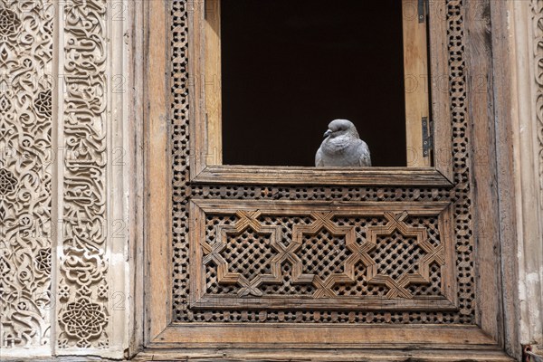 Rich decorated facade in the courtyard of the Medersa Attarine in Fes, Morocco, Africa