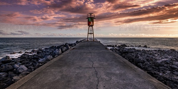 Jetty and lighthouse in Saint Pierre, La Reunion island, Indian Ocean, april 26, 2016, Saint Pierre, France, Europe