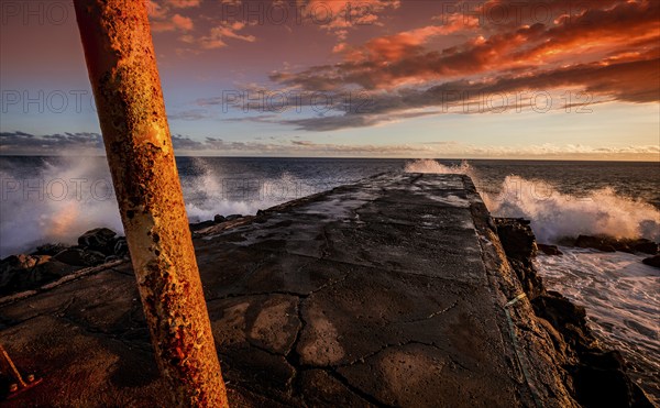 Jetty and lighthouse in Saint Pierre, La Reunion island, Indian Ocean, april 26, 2016, Saint Pierre, France, Europe