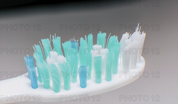 Toothbrush with used bristles. Close up of a used toothbrush