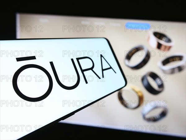 Stuttgart, Germany, 07-11-2024: Smartphone with logo of Finnish health technology company Oura Health Oy in front of business website. Focus on center-left of phone display, Europe