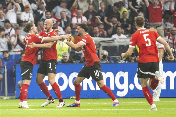 BERLIN, GERMANY - JUNE 21, 2024: Euro 2024 Groupe D match Poland vs Austria 1:3. Team of Austria Marcel Sabitzer (L) Gernot Trauner (M) Florian Grillitsch (R) joy after score the goal.