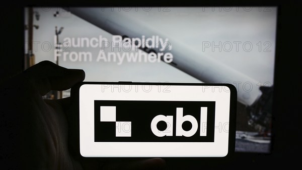 Stuttgart, Germany, 07-14-2024: Person holding cellphone with logo of US aerospace company ABL Space Systems in front of business webpage. Focus on phone display, Europe