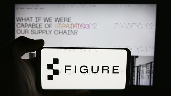 Stuttgart, Germany, 07-11-2024: Person holding cellphone with logo of US artificial intelligence robotics company Figure AI Inc. in front of webpage. Focus on phone display, Europe