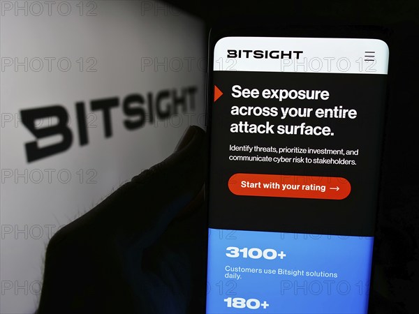 Stuttgart, Germany, 07-14-2024: Person holding cellphone with webpage of cybersecurity ratings company BitSight Technologies Inc. with logo. Focus on center of phone display, Europe