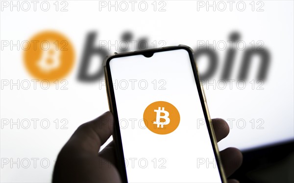 Bitcoin digital cryptocurrency money on the screen of a smartphone