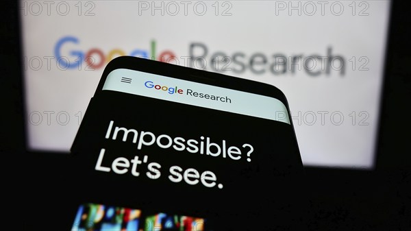 Stuttgart, Germany, 04-02-2024: Smartphone with website of US technology company Google Research in front of business logo. Focus on top-left of phone display, Europe