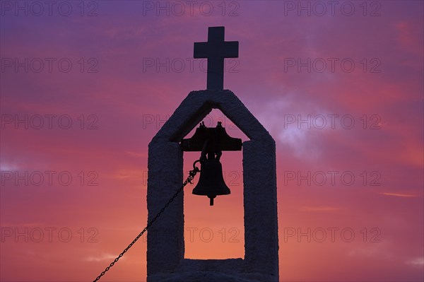 Dawn, sunrise, Rodopou Peninsula, Small Chapel, Bell Tower with Cross, detail, silhouette, red cloudy sky, Gramvoussa Peninsula, Pirate's Bay, Balos, Tigani, Western Crete, Crete Island, Greece, Europe