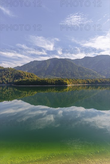 Intake structure at the Sylvenstein reservoir is used for flood protection, dams the Isar, power station, power generation, forest, water reflection, blue sky