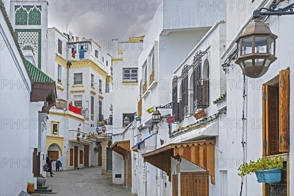 White houses and closed shops in shopping street on Friday in medina of the city Tangier, Tanger, Morocco, Africa