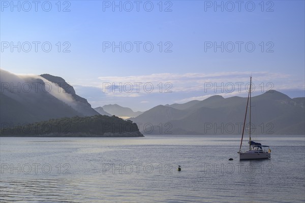 Sailing ship and morning fog over the mountains, Trstenik, Dubrovnik-Neretva County, Croatia, Europe