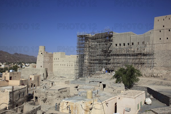 Bahla, Hisn Tamah Fortress, Hisn Tamah Fortress, probably built in the 17th century by the Nabhani tribe on a stone foundation with unbaked mud bricks and straw, lies in the middle of the city wall. The massive fortress has a total of 15 gates and 132 defence towers, Unseco World Heritage Site, under restoration from 2008-2018, Oman, Asia