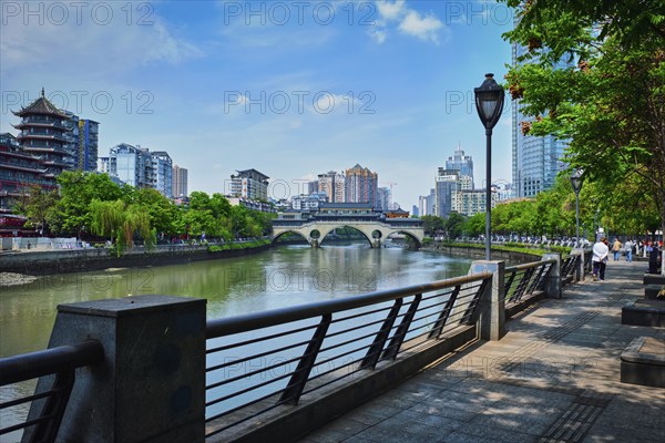 CHENGDU, CHINA, APRIL 15, 2018: Embankment quay of Jin river and Anshun bridge in Chengdu, Sichuan, China, Asia