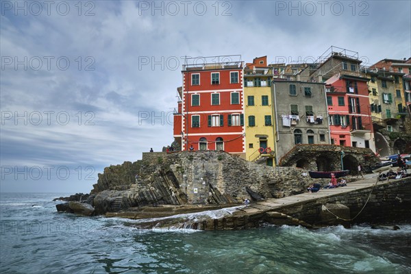 RIOMAGGIORE, ITALY, APRIL 25, 2019: Riomaggiore village popular tourist destination in Cinque Terre National Park a UNESCO World Heritage Site, Liguria, Italy in stormy weather