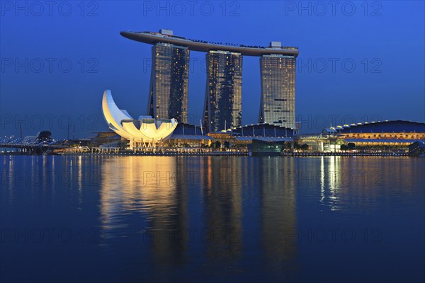 SINGAPORE, MAY 6: The Marina Bay Sands complex on sunset on May 6, 2011 in Singapore. Marina Bay Sands is an integrated resort and billed as the world's most expensive standalone casino property