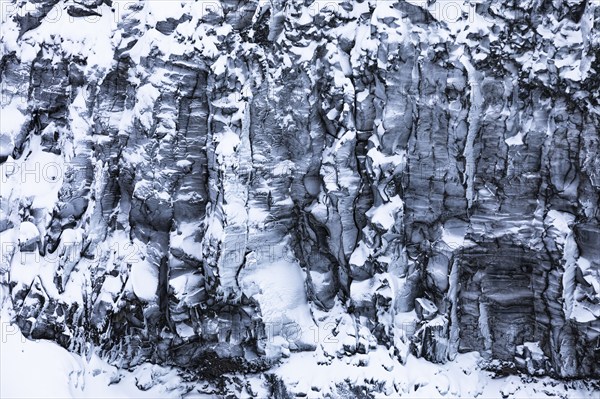 Iced and snow-covered rock face near Dettifoss waterfall, Northern Iceland Eyestra, Iceland, Europe