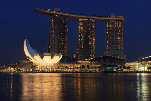 SINGAPORE, MAY 6: The Marina Bay Sands complex on sunset on May 6, 2011 in Singapore. Marina Bay Sands is an integrated resort and billed as the world's most expensive standalone casino property