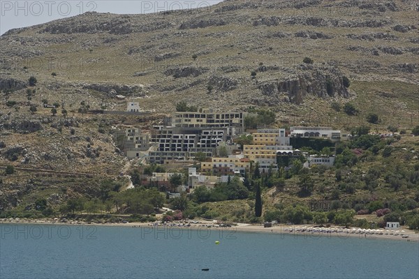 Rhodes Island, Lindos, Lindos is a town on the Greek island of Rhodes. Its landmark is the acropolis on a rock with huge archways from the 4th century and reliefs dating from around 280 BC