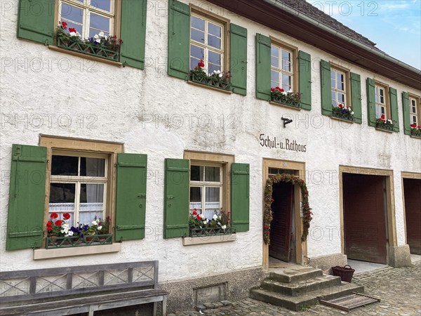 Historic schoolhouse of Bubsheim from 1830 with green shutters rebuilt in the open-air museum Neuhausen, Neuhausen ob Eck, district Tuttlingen, Baden-Württemberg, Germany, Europe