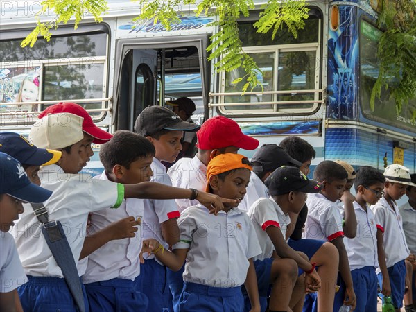 Schoolchildren with school bus and school uniform on an excursion, Sri Lanka, Asia