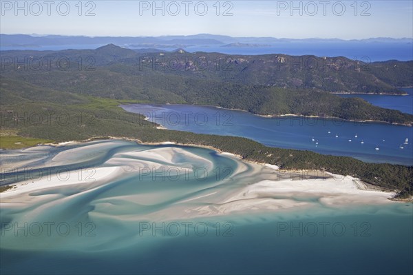 Areal view of white sandy beaches and turquoise blue water of Whitehaven Beach on Whitsunday Island in the Coral Sea, Queensland, Australia, Oceania