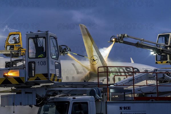 Winter at Frankfurt Main Airport, FRA, Lufthansa aircraft being de-iced by de-icing vehicles, Hesse, Germany, Europe